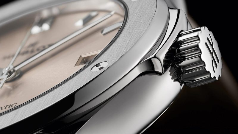 Hublot Classic Fusion Essential Taupe in titanium with sunburst taupe dial, polished bezel, and textured strap in 42mm and 45mm sizes.