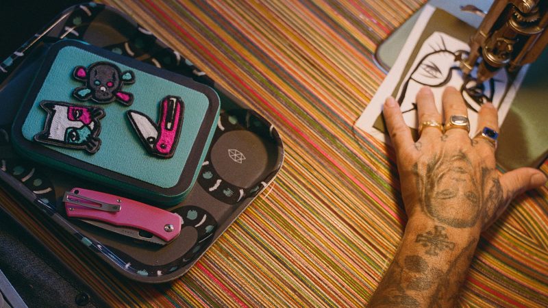 The James Brand × Mark Oblow Artist Series utility knife, EDC notebook sleeve, and graphic tee featuring skate-inspired design and West Coast street art.