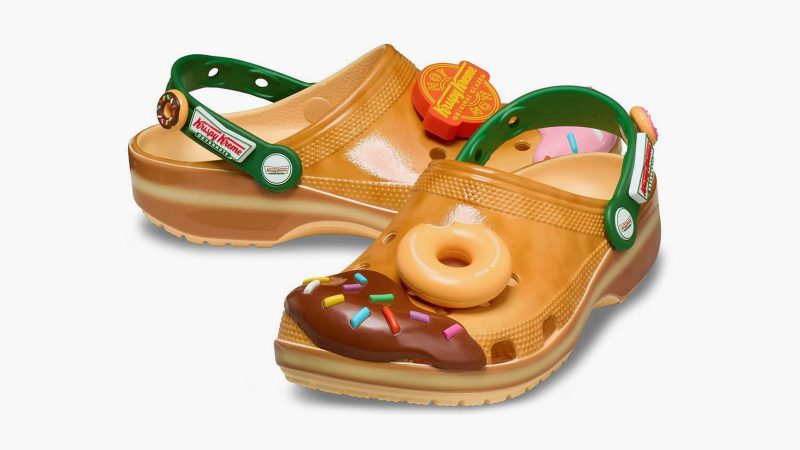 Krispy Kreme x Crocs Classic Clogs feature donut glaze-inspired design, sprinkle-themed Jibbitz charms, and co-branded heel straps.