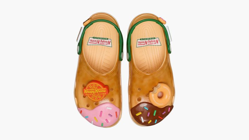 Krispy Kreme x Crocs Classic Clogs feature donut glaze-inspired design, sprinkle-themed Jibbitz charms, and co-branded heel straps.