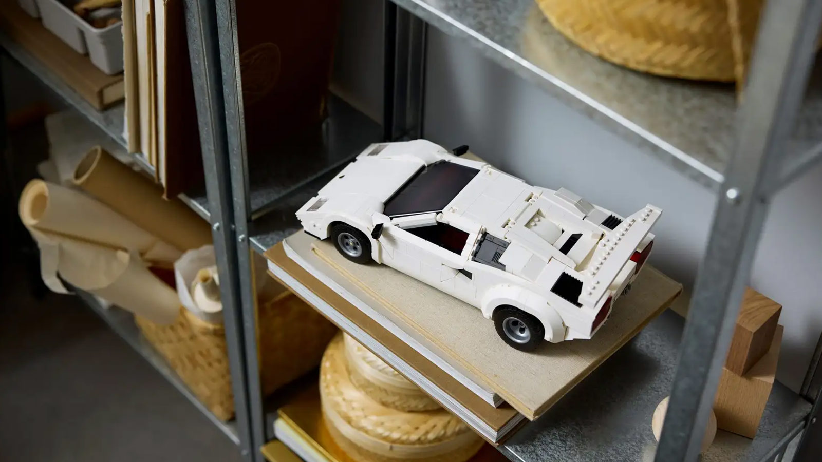 LEGO model of a white Lamborghini Countach displayed on a shelf—an iconic supercar kit in the Best LEGO Sets for Adults 2025 lineup.