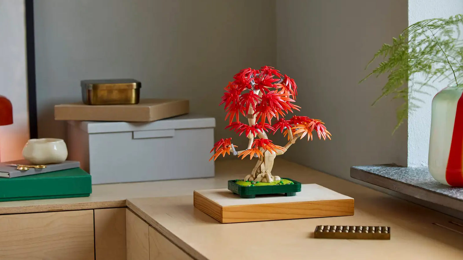 Zen-inspired LEGO bonsai tree with red foliage, a peaceful and stylish option among the Best LEGO Sets for Adults 2025.