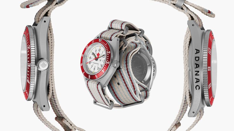 The Marathon ADANAC Navigator Pilot’s Automatic Watch features a red maple leaf on an Arctic white dial, a stainless steel case, and a red 12-hour GMT bezel.