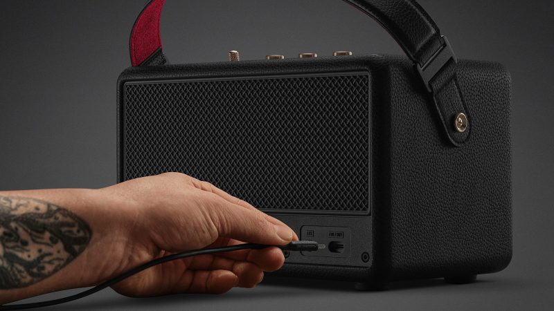 Marshall Kilburn III portable speaker with gold control panel, red velvet strap, and rugged speaker grille delivering 360° sound.