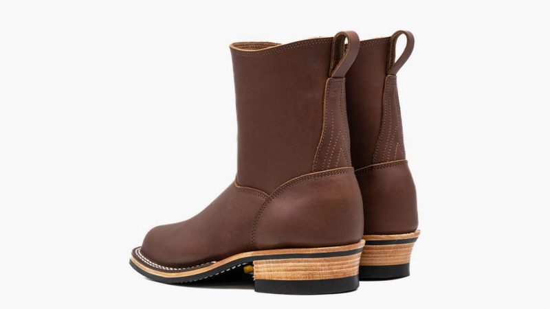 Nicks Doc Wellington boots in full-grain leather with a classic pull-on design, elevated heel, and reinforced stitching—ideal for work and travel.