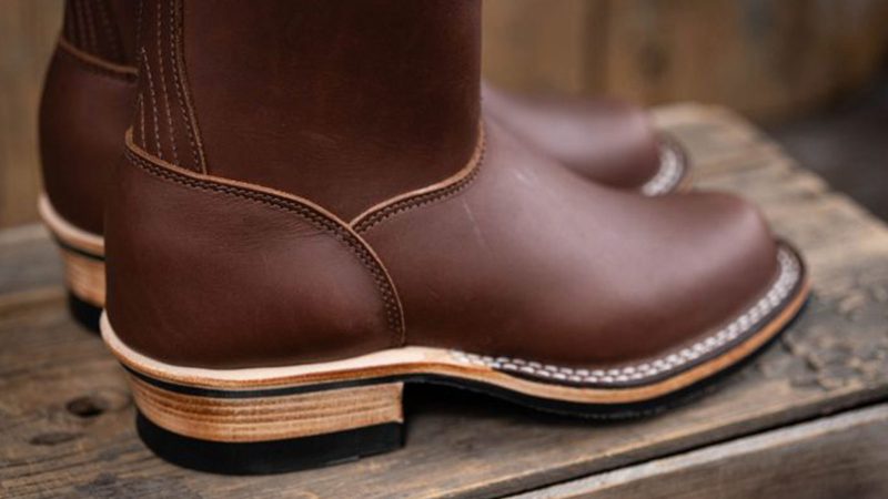 Nicks Doc Wellington boots in full-grain leather with a classic pull-on design, elevated heel, and reinforced stitching—ideal for work and travel.