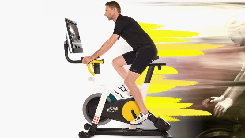 NordicTrack Tour de France indoor exercise bike with incline/decline simulation, iFIT compatibility, smart resistance, and pro training features.