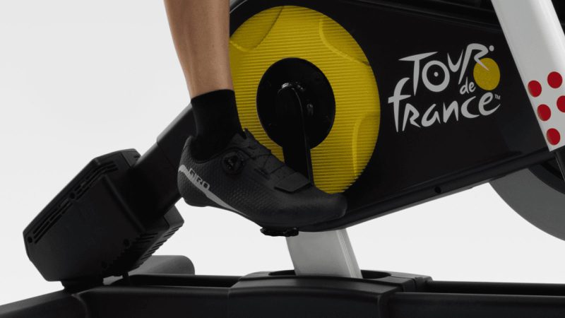 NordicTrack Tour de France indoor exercise bike with incline/decline simulation, iFIT compatibility, smart resistance, and pro training features.