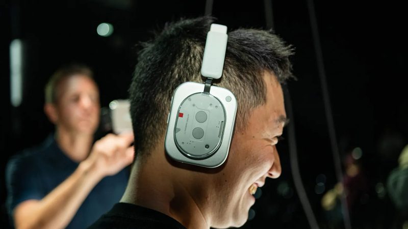 Nothing Phone (3) with Glyph Matrix display and red recording light, alongside KEF-tuned Headphone (1) with industrial design and tactile controls.