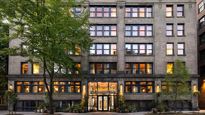 Populus Seattle Hotel showcases sleek minimalist architecture with floor-to-ceiling windows, natural materials, and panoramic views—perfect for modern travelers seeking smart luxury and design-forward accommodations.