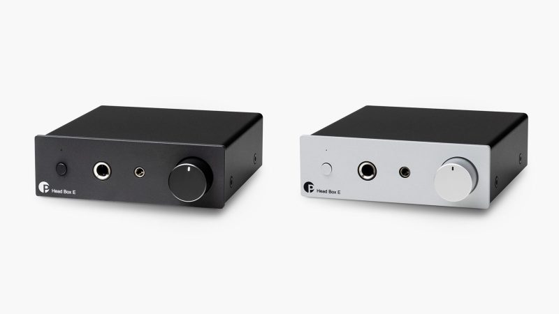 The Pro-Ject Head Box E headphone amplifier, available in black and silver, offers dual outputs, RCA inputs, and a full metal chassis for audiophile-grade headphone performance.