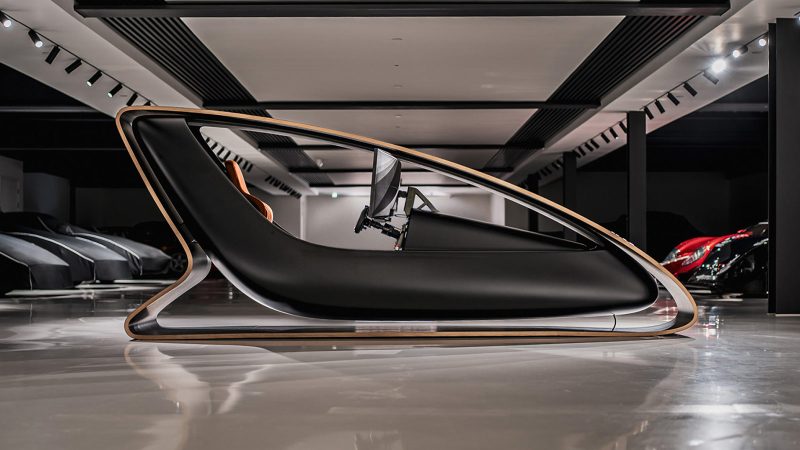 The Prodrive Racing Simulator features a carbon fiber monocoque frame, wraparound screen, racing seat, and professional steering hardware—combining high-performance engineering with luxury aesthetics.