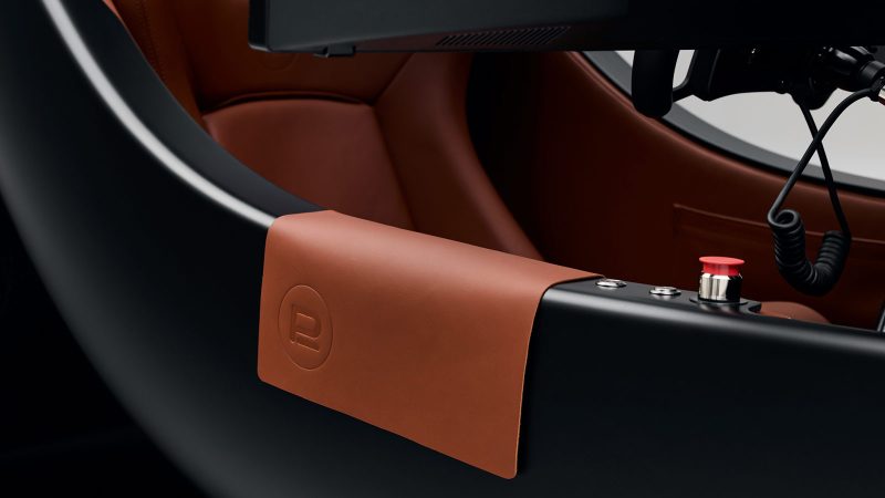 The Prodrive Racing Simulator features a carbon fiber monocoque frame, wraparound screen, racing seat, and professional steering hardware—combining high-performance engineering with luxury aesthetics.