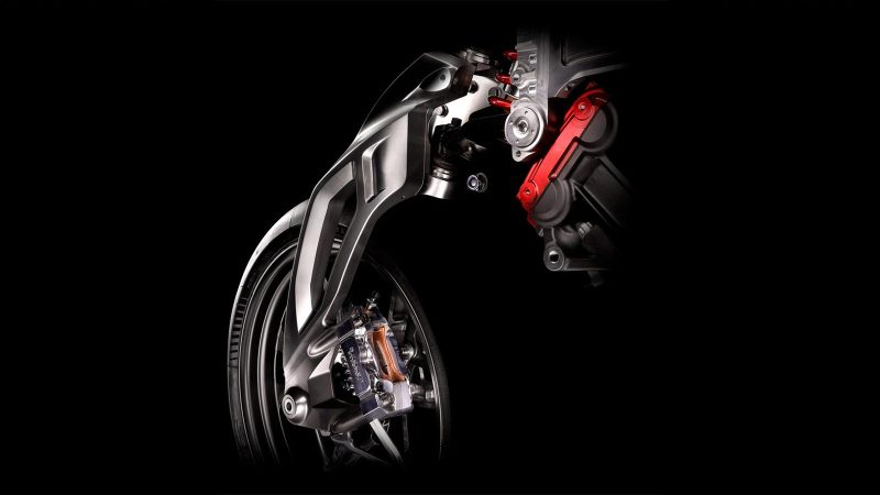 RMB01 track motorcycle by Richard Mille and Brough Superior with exposed carbon frame, gear‑inspired rims, and watch‑style instrument cluster.