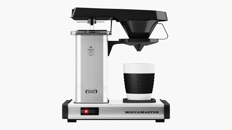 Technivorm Moccamaster One‑Cup Coffee Maker in metal housing with copper heating element, single-cup steep basket, and removable cup tray.
