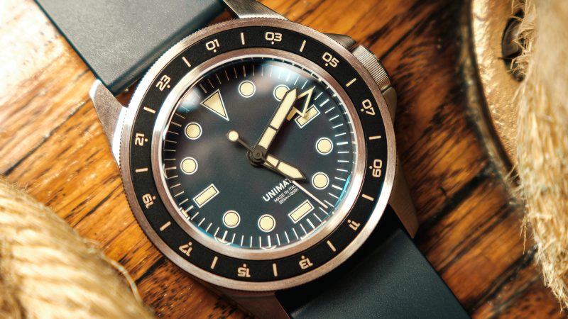 UNIMATIC Diving Heritage wristwatch collection featuring matte black, tropical brown, and vintage navy dials, creamy Super‑LumiNova markers, and brushed stainless steel cases.