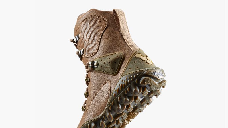 The VIVOBarefoot Desert ESC boot features a camel leather upper, a Michelin lugged outsole, and a high ankle collar designed for protection in desert and extreme terrain.