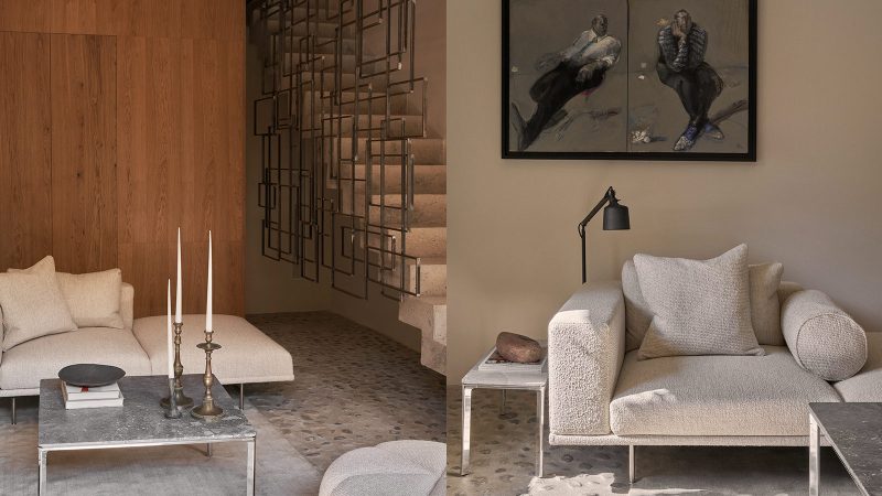 Exterior and interior of Vipp Townhouse in Lagrasse: historic 14th-century stone walls blend with minimalist Scandinavian furnishings and modern marble details.
