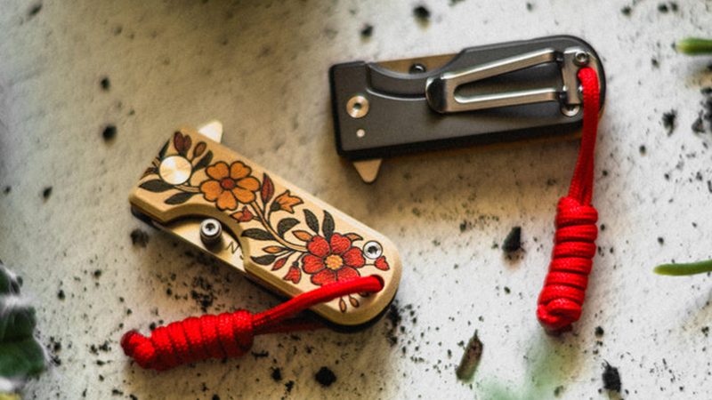 The WESN Grow North Microblade features bright floral G10 scales, a titanium back handle, and antique brass coin packaging—limited to 200 units for summer 2025.