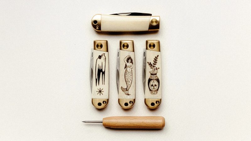 The WESN x P&Co. Scrimshaw Henry pocket knives feature laser-etched tattoo-style artwork on titanium handles, blending EDC functionality with heritage design.