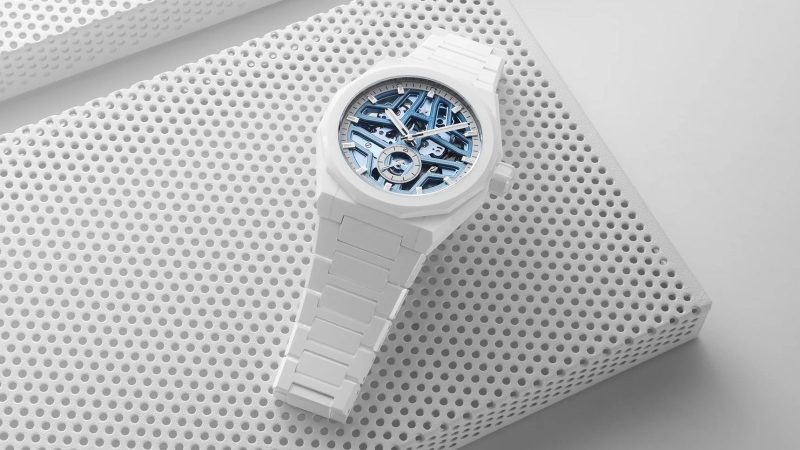 Limited‑edition Zenith Defy Skyline Skeleton White Surfer in 41 mm white ceramic, blue gradient skeleton dial, integrated bracelet and quick‑change strap.