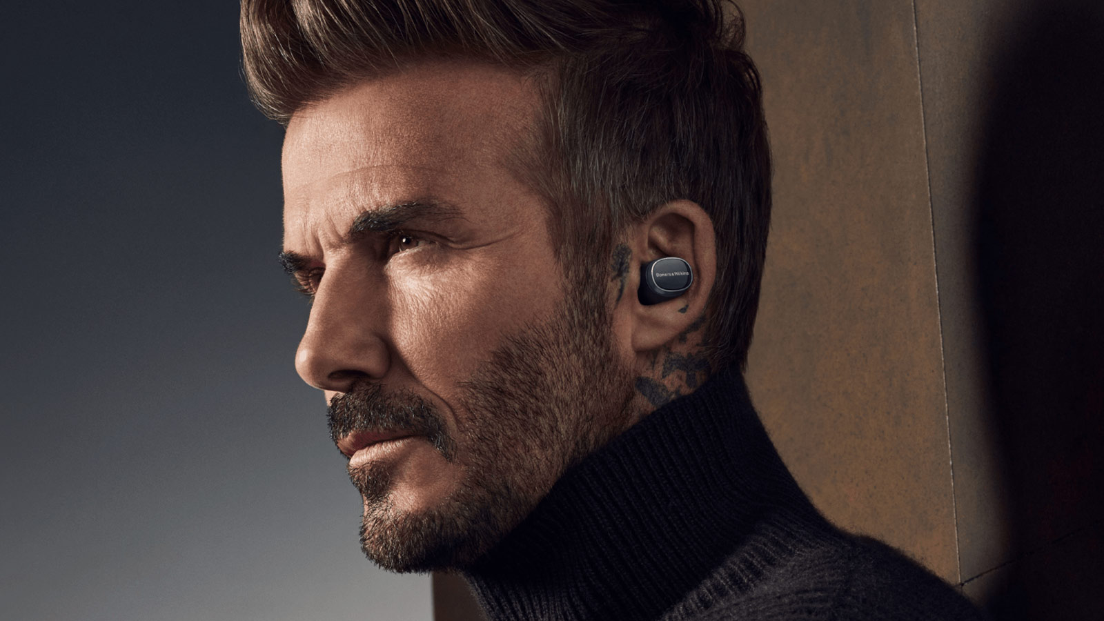 David Beckham models Bowers & Wilkins PI8 earbuds, a high-end contender among the best wireless earbuds for professionals.
