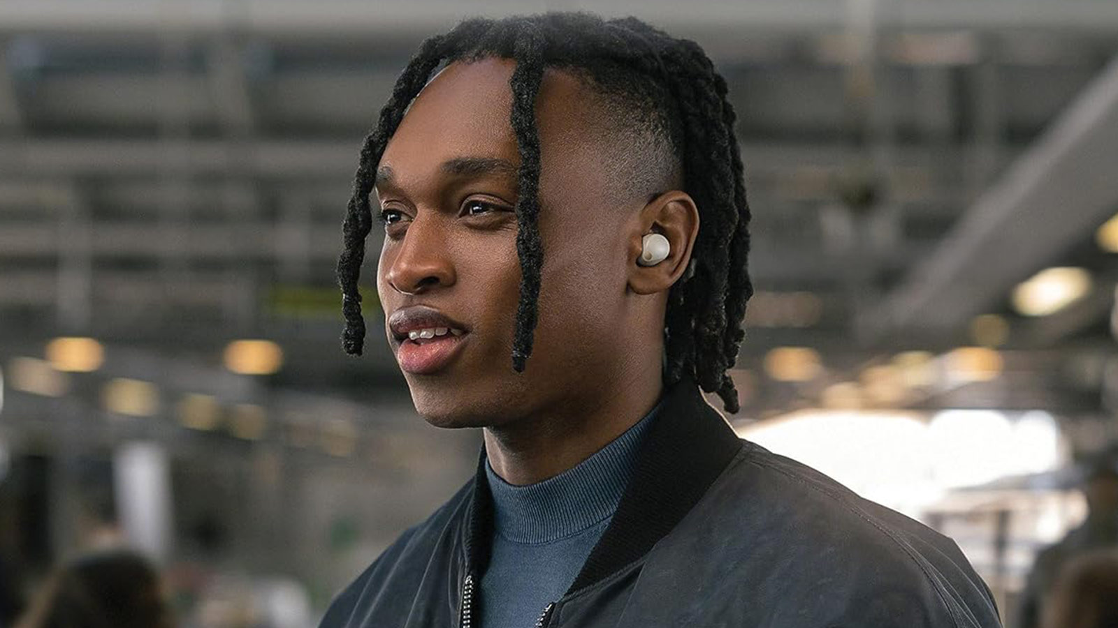 Sony WF-1000XM5 earbuds in use during commute, showcasing their noise-canceling capabilities as one of the best wireless earbuds for daily travel.