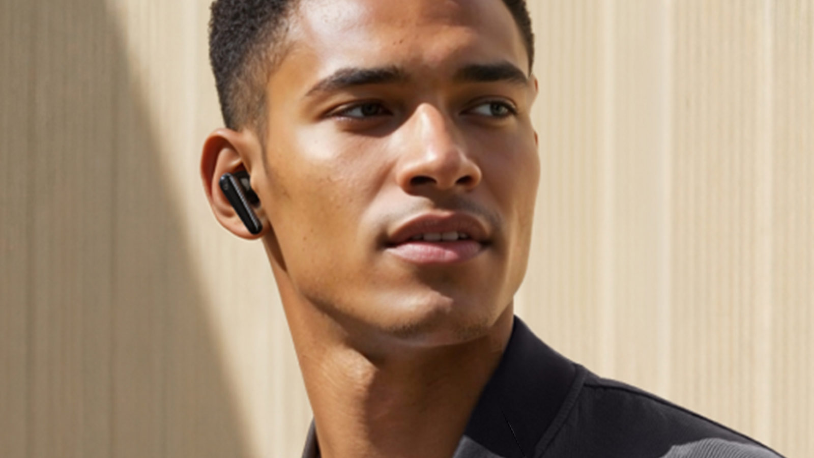 Man wearing Soundcore Liberty 5 by Anker earbuds, a budget-friendly option among the best wireless earbuds for work and daily commuting.
