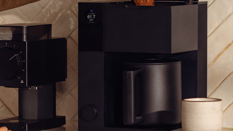 Fellow coffee machine and grinder on a countertop – minimalist brewing gear for modern home essentials for men who love great coffee.