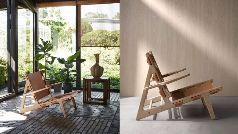 The Fredericia Hunting Chair in soaped oak with saddle leather, designed by Børge Mogensen, showcases minimalist Danish craftsmanship and luxury seating.