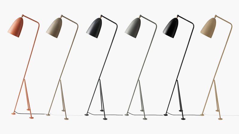 The GUBI Gräshoppa Floor Lamp boasts a tilted tripod base, an adjustable ball-joint shade, and mid-century Scandinavian design.