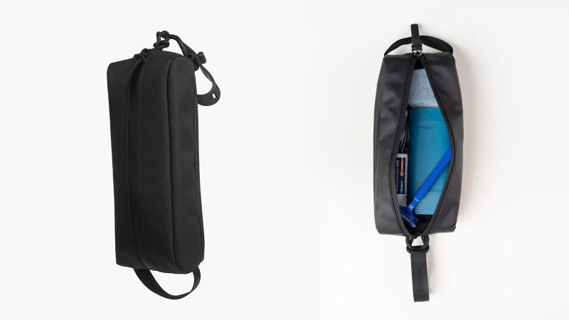 Gravel Explorer Toiletry Bag Collection featuring MINI, SLIM, PLUS, and MAX designs with a rugged tarpaulin build, multiple organizational pockets, TSA-friendly options, and adjustable hang straps.