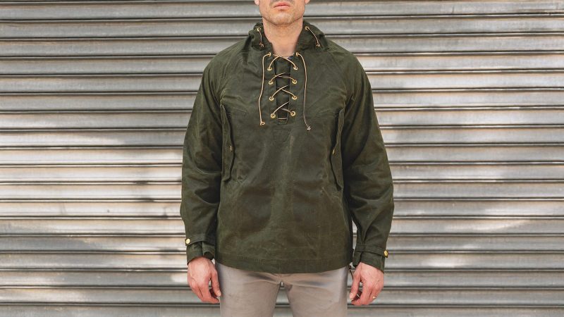 Heat Straps’ Waxed Anorak jacket in rugged weatherproof finish, designed for durability, outdoor performance, and street-ready urban style.