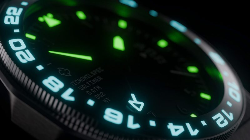 Micromilspec Dualtimer GMT pilot watch in brushed stainless steel with dual-color lume, Swiss automatic movement, and 24-hour rotating bezel.