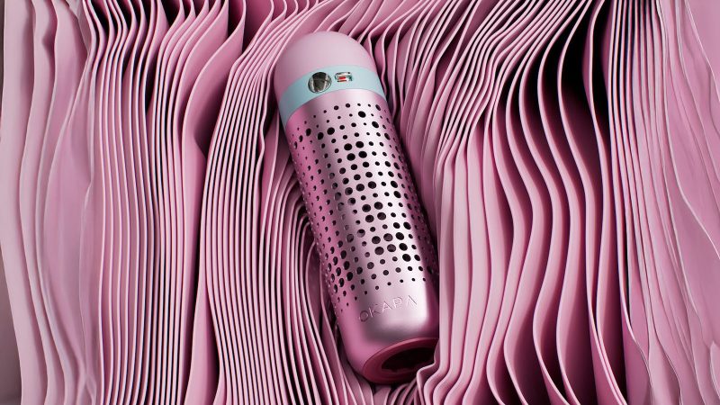The OKAPA Water Bottle features a German borosilicate glass core, anodized aluminum shell, and a precision Swiss-made spout.