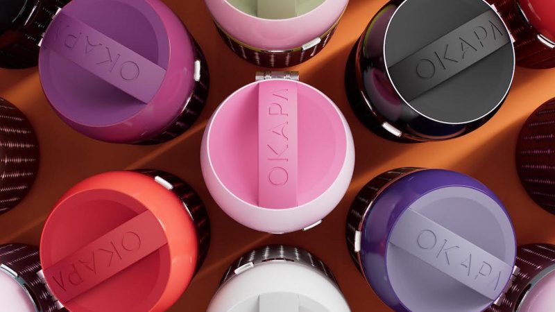 The OKAPA Water Bottle features a German borosilicate glass core, anodized aluminum shell, and a precision Swiss-made spout.