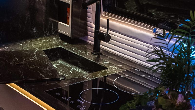 Robeta Mobil Ananya GlamperVan features an L-shaped lounge, a Skywindow roof panel, premium finishes, and a built-in washer/dryer.