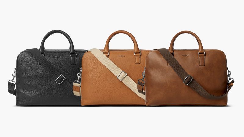 Shinola Double Zip Briefcase in premium Navigator leather with dual compartments, a padded laptop sleeve, and an adjustable strap for work and travel.