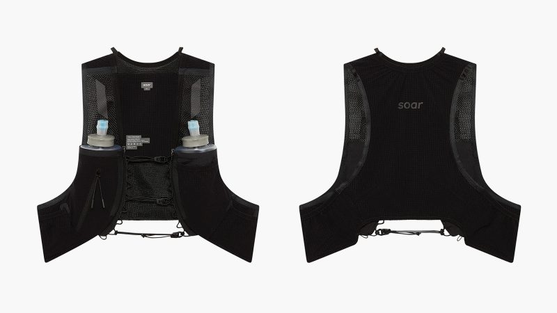 Soar Trail Race Pack—ultralight trail vest with tensioned cords, quad-axial mesh, Dyneema stretch, 8 integrated pockets, and cheek-contoured bottle design.