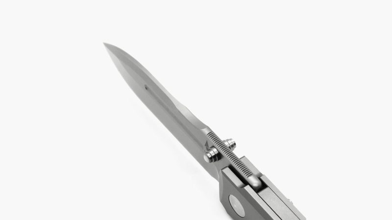 Terrain 365 Invictus-ATB-SP folder knife featuring a rust-proof Terravantium blade, titanium framelock and pivot with ceramic bearings, carbon-fiber handle side—designed for all-terrain utility.