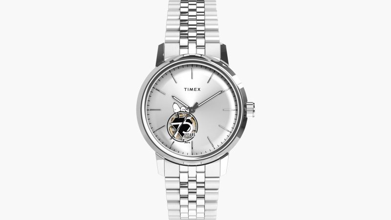 Timex x Peanuts® Marlin® Automatic 75th Anniversary Edition watch with silver sunray dial, exhibition caseback, and polished stainless-steel bracelet.