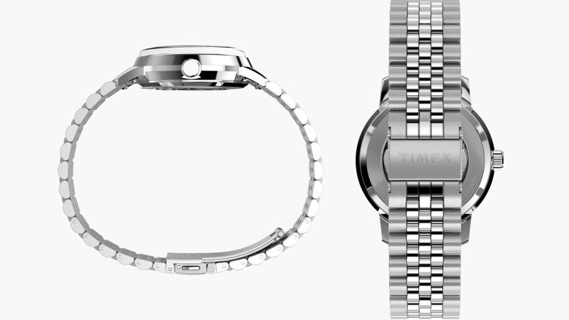 Timex x Peanuts® Marlin® Automatic 75th Anniversary Edition watch with silver sunray dial, exhibition caseback, and polished stainless-steel bracelet.