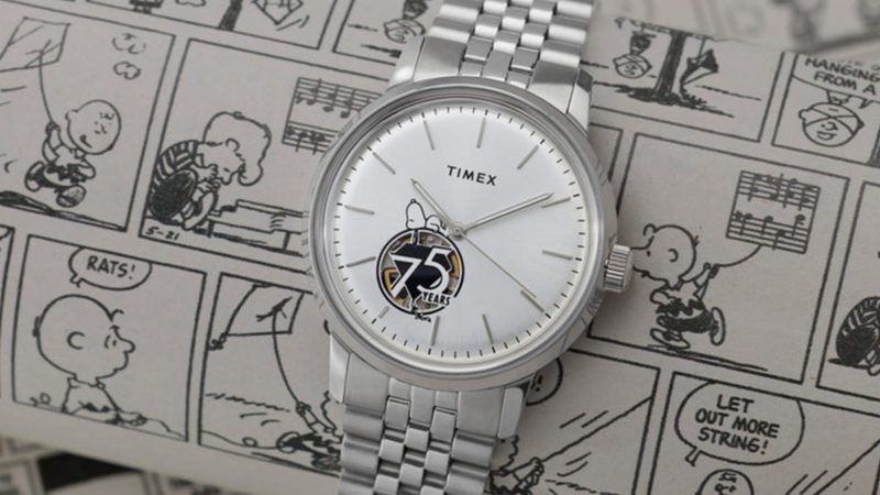 Timex x Peanuts® Marlin® Automatic 75th Anniversary Edition watch with silver sunray dial, exhibition caseback, and polished stainless-steel bracelet.