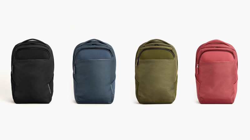 Troubadour Neo Backpack features a waterproof coating, a laptop sleeve, and a lightweight design for travel and commuting.