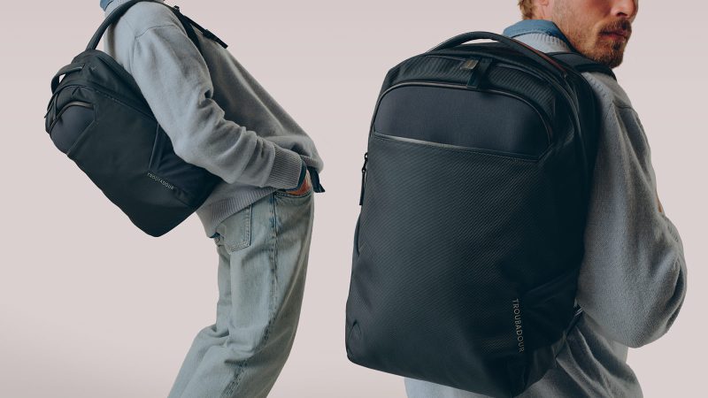 Troubadour Neo Backpack features a waterproof coating, a laptop sleeve, and a lightweight design for travel and commuting.