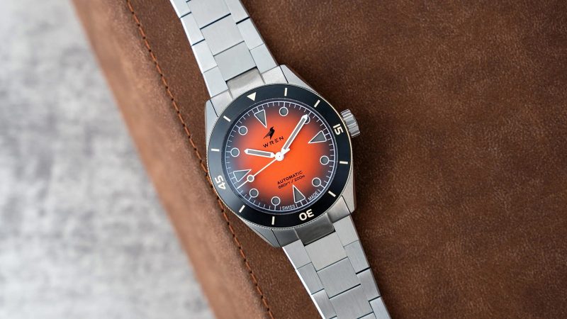 The Wren Diver One Magma shows its fiery lava-inspired fumé dial, ceramic bezel, and stainless-steel case with black lume accents.