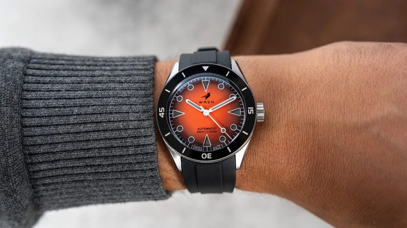 The Wren Diver One Magma shows its fiery lava-inspired fumé dial, ceramic bezel, and stainless-steel case with black lume accents.