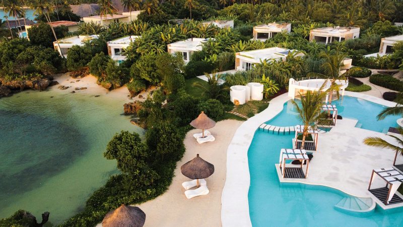 Ycona Luxury Resort in Zanzibar features private beachfront villas surrounded by lush tropical gardens and sustainable architecture.