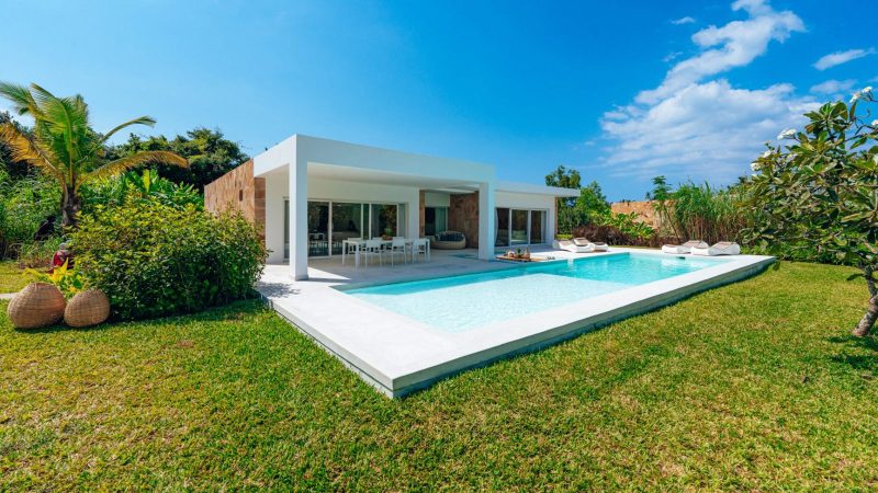 Ycona Luxury Resort in Zanzibar features private beachfront villas surrounded by lush tropical gardens and sustainable architecture.