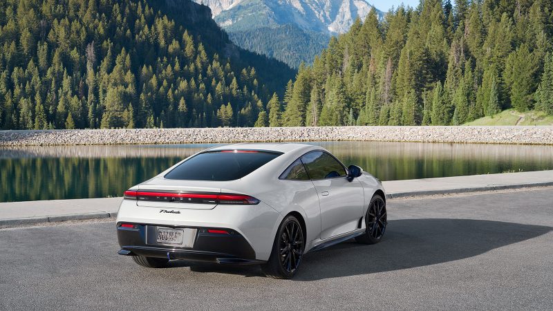 The 2026 Honda Prelude hybrid-electric sports coupe features a wide stance, flared fenders, Berlina Black wheels, and sleek GT styling.